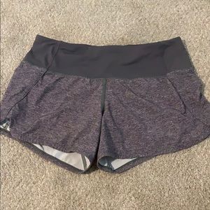 Grey Lululemon Speed Up shorts.
